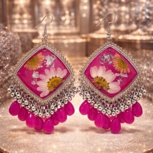 Hand made pink resin art earrings with white glower and silver design