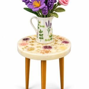 Hand made table with ceramic vase and bunch of crochet flowers